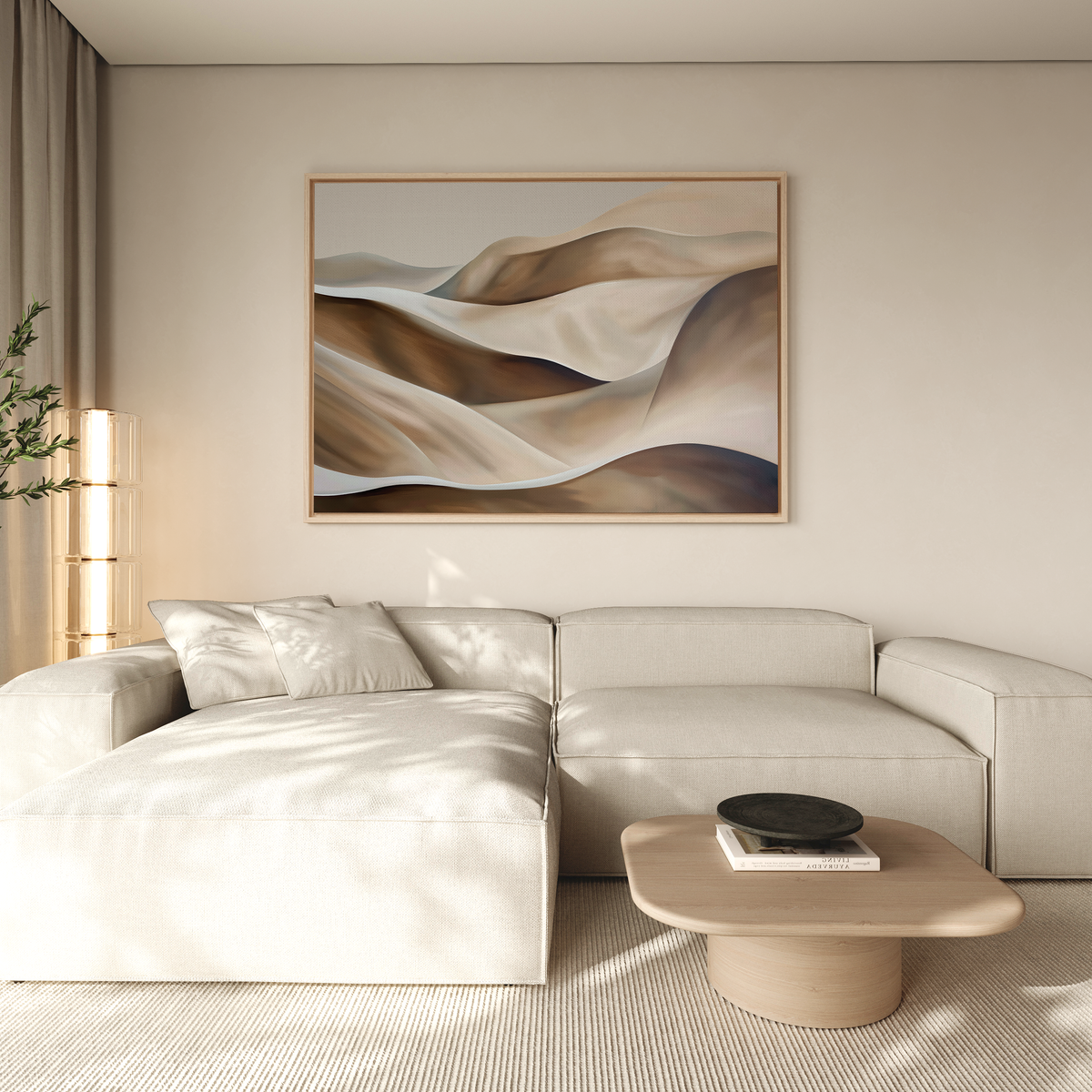 A modern living room with a light beige sectional, low wooden coffee table, neutral walls, and soft natural light. Minimalist wall art—Desert Waves Abstract Canvas Art—of sand dunes hangs above, creating a serene atmosphere.
