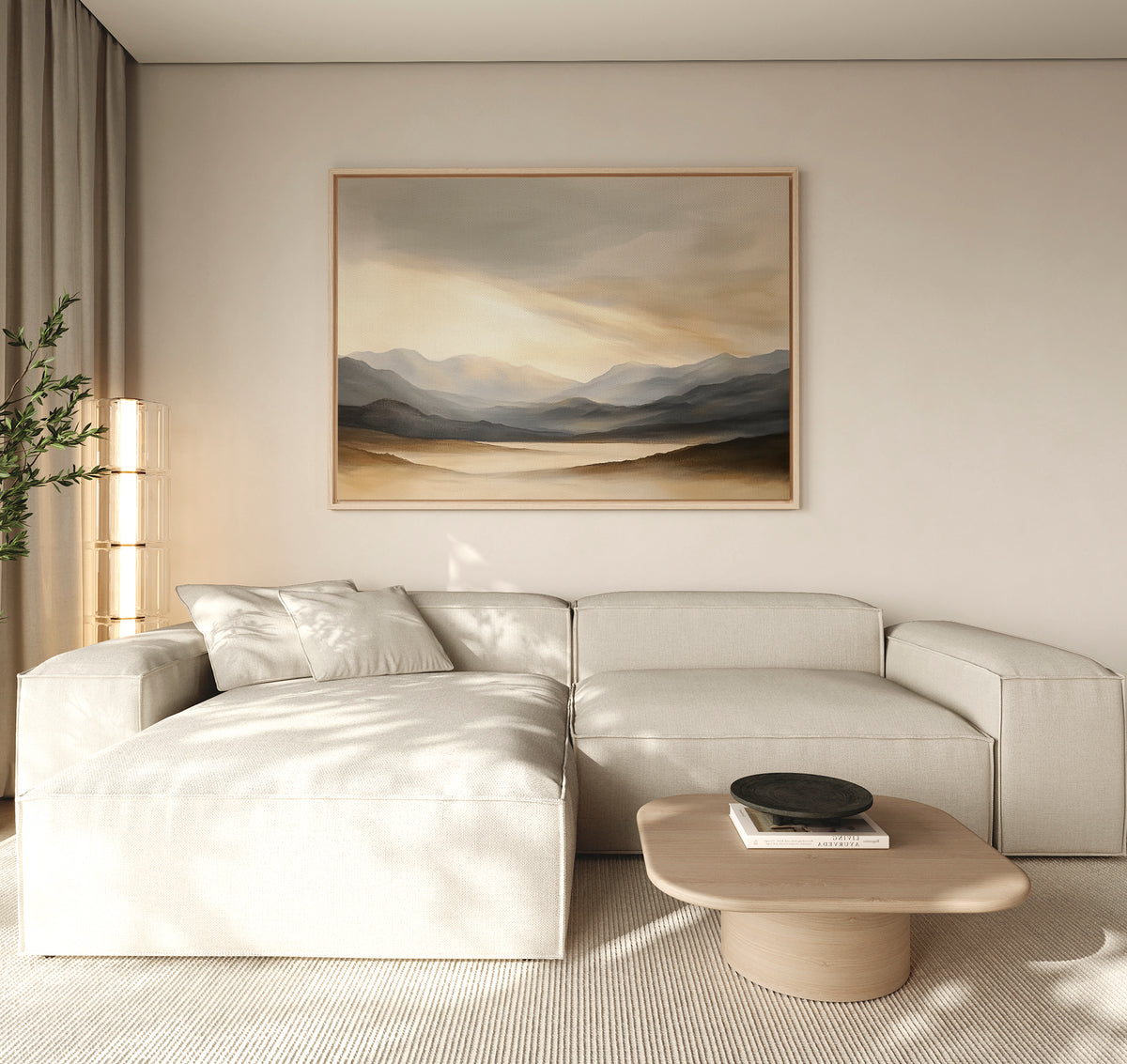 A modern living room featuring a light beige sectional sofa, wooden coffee table with black bowl, floor lamp, potted plant, and serene "Mountain Reverie Canvas Art - Horizontal" displayed above the sofa.