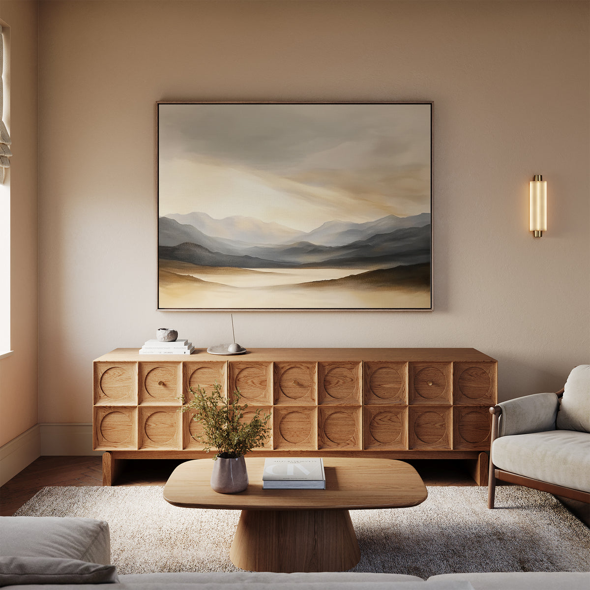 A cozy living room with a light wood coffee table, textured wooden sideboard, and the Mountain Reverie Canvas Art - Horizontal. A white sofa and neutral decor create a calm, minimalist atmosphere enhanced by serene wall art.
