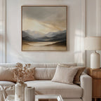 A modern living room features a beige sofa, neutral pillows, a side table with a lamp, dried flowers in a vase, and the Mountain Reverie Canvas Art - Square as serene wall decor—adding tranquility to the space.