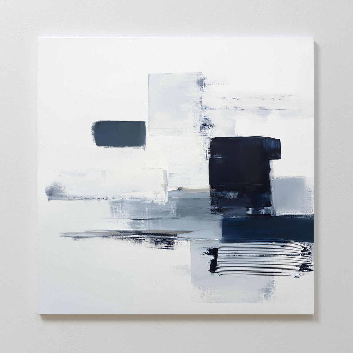 Navy Brushwork Canvas Art - Square features overlapping rectangles in white, gray, and dark blue with textured brushstrokes. This modern abstract piece adds a minimalist vibe to any space and looks striking when mounted on a white wall.