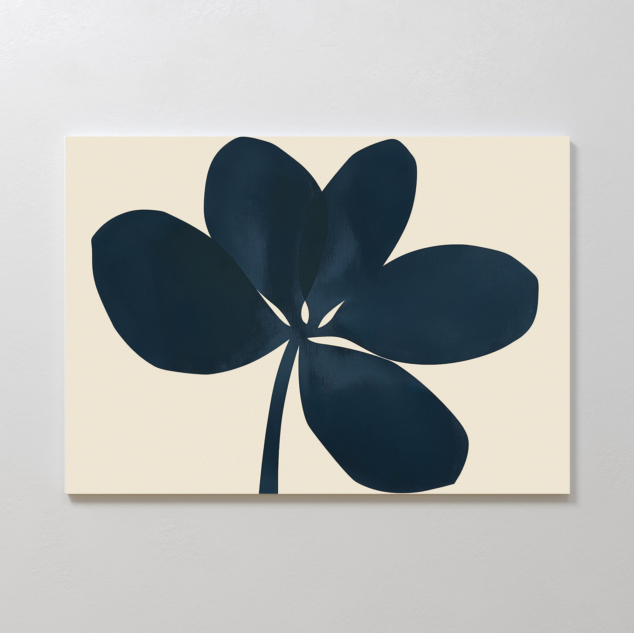 The Navy Clover Canvas Art - Horizontal features a dark blue abstract flower with five rounded petals and a thin stem on a light beige background, creating striking minimalist wall art for any contemporary space.