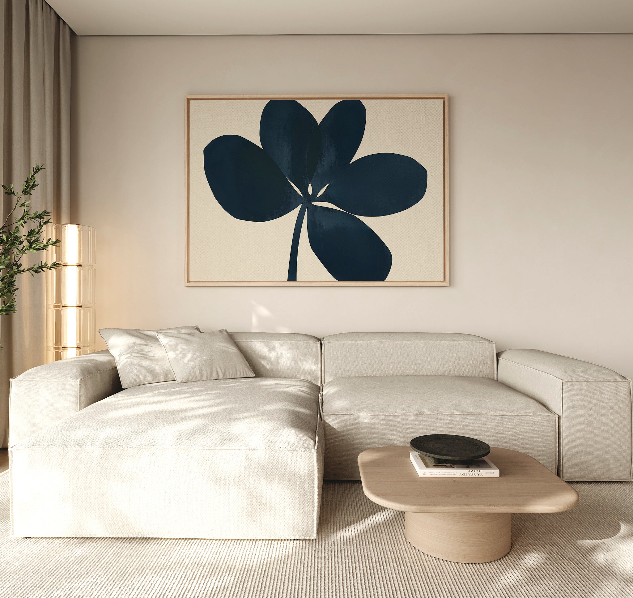 A modern living room with a light beige sectional, a low wooden coffee table, and minimalist wall decor featuring the Navy Clover Canvas Art - Horizontal. A tall plant and sheer curtains add a cozy touch.