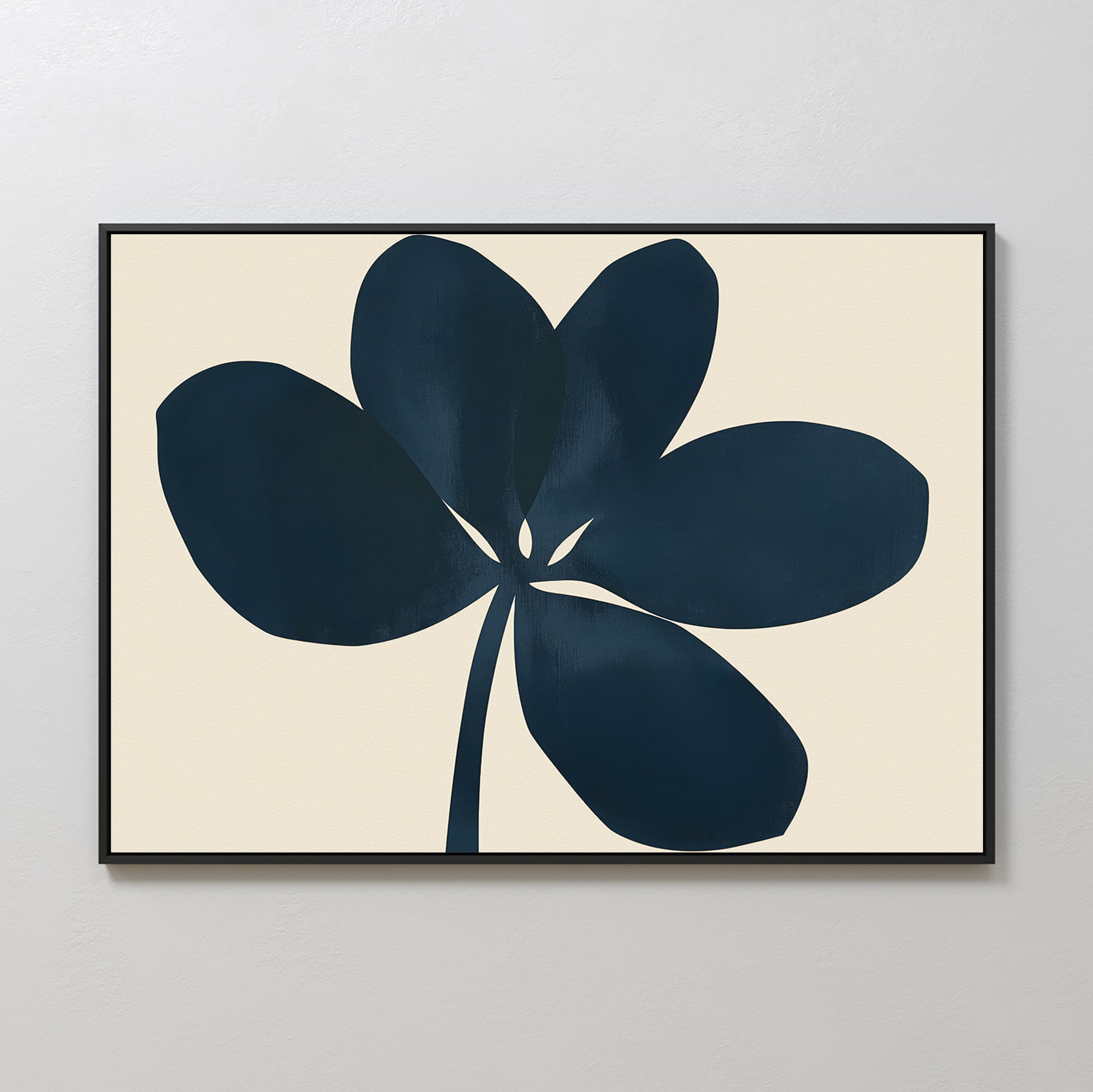 The Navy Clover Canvas Art - Horizontal features a dark blue abstract five-petal flower with a single stem on a light beige background, framed in black for a minimalist touch and designed to elevate any plain white wall.