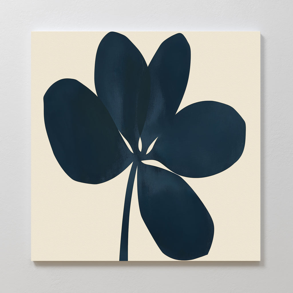 The Navy Clover Canvas Art - Square features a minimalist painting of a dark blue, abstract five-petal flower on a light beige background, ideal as botanical wall art and striking when displayed on a white wall.