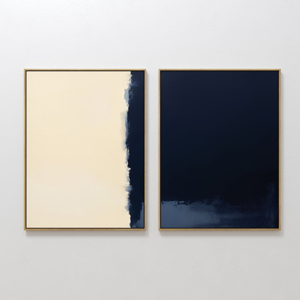 Navy Division - Set Of 2 features two minimalist prints in gold frames on a white wall; the left has beige and dark blue with a rough edge, while the right is mostly solid dark blue with subtle texture at the bottom.