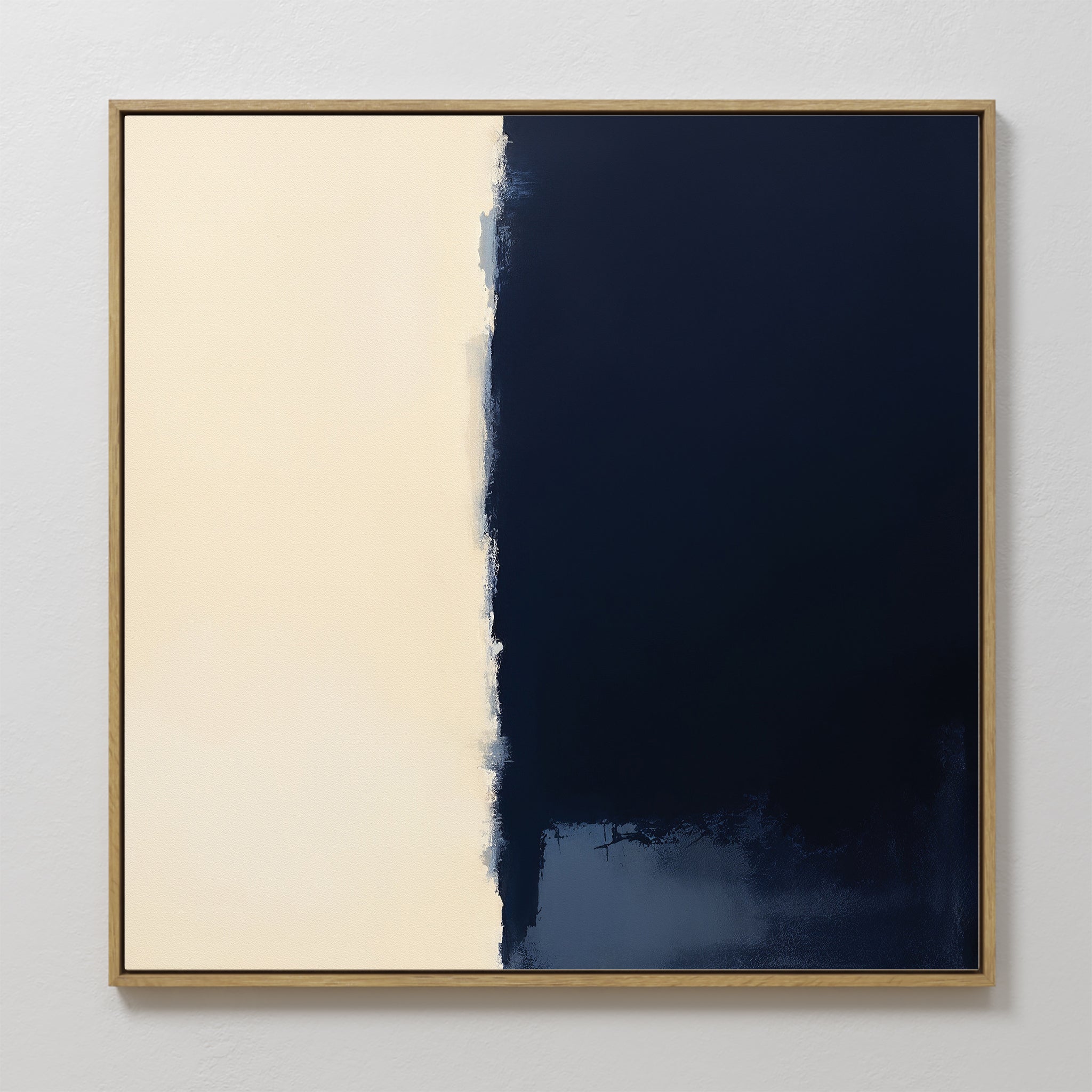 Navy Division Canvas Art - Square features two vertical sections: smooth off-white on the left and deep navy blue on the right, divided by a jagged center border. Framed in light wood, this minimalist print adds Nordic style to any space.