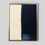 Navy Division Canvas Art - Vertical: Abstract piece with a gold frame, showcasing two vertical sections—light beige on the left and dark navy on the right, separated by a rough, blended edge for a modern minimalist look.