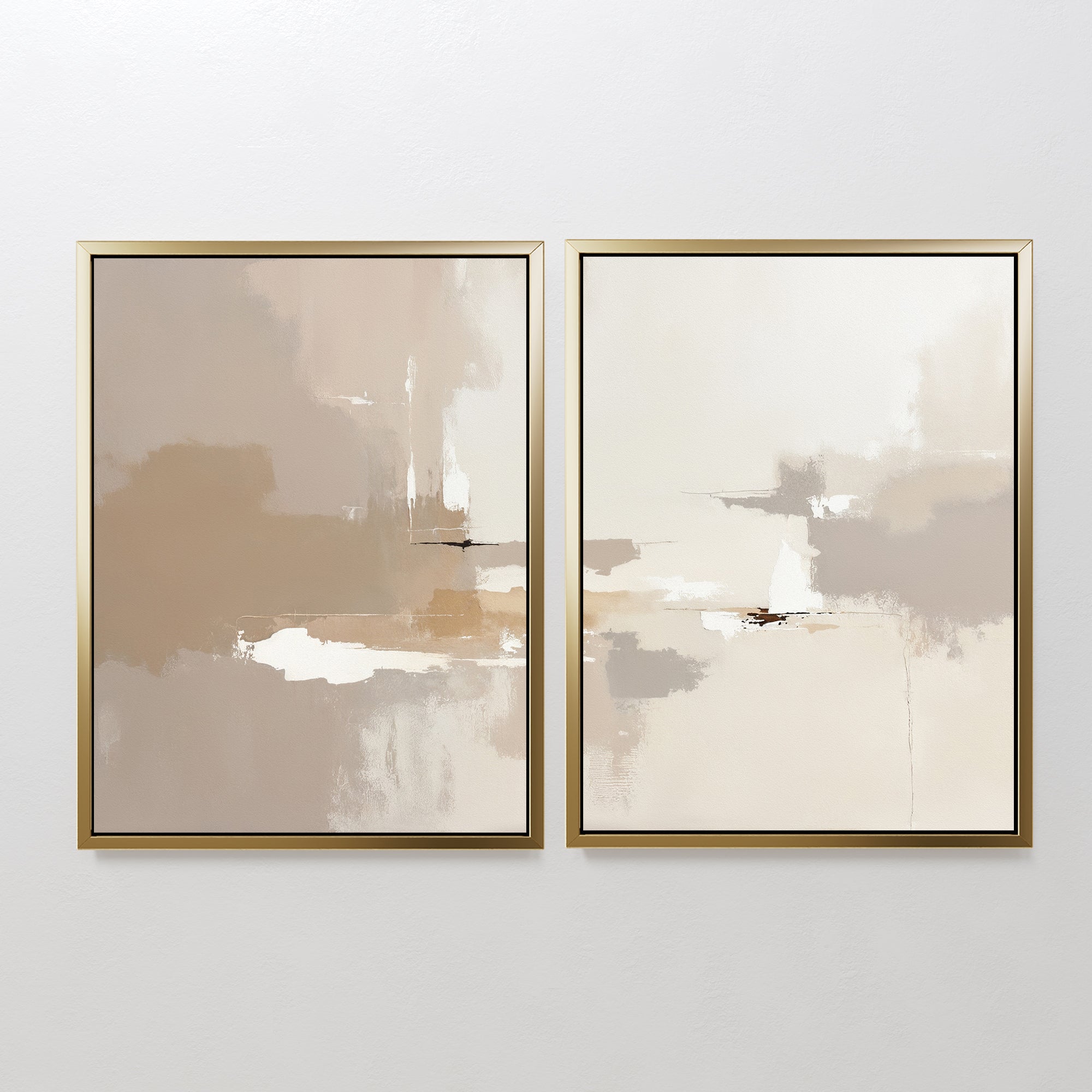 Neutral Territory - Set Of 2 features two abstract prints in gold frames, displayed side by side on a white wall, with soft beige, tan, white, and brown brushstrokes that add a touch of minimalist and contemporary elegance.