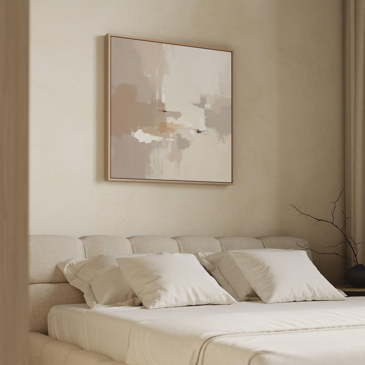 A minimal bedroom features a beige upholstered bed with white bedding and pillows. Above the bed hangs the Neutral Territory Canvas Art - Square. Soft light filters through curtains, and a simple vase with bare branches sits nearby.