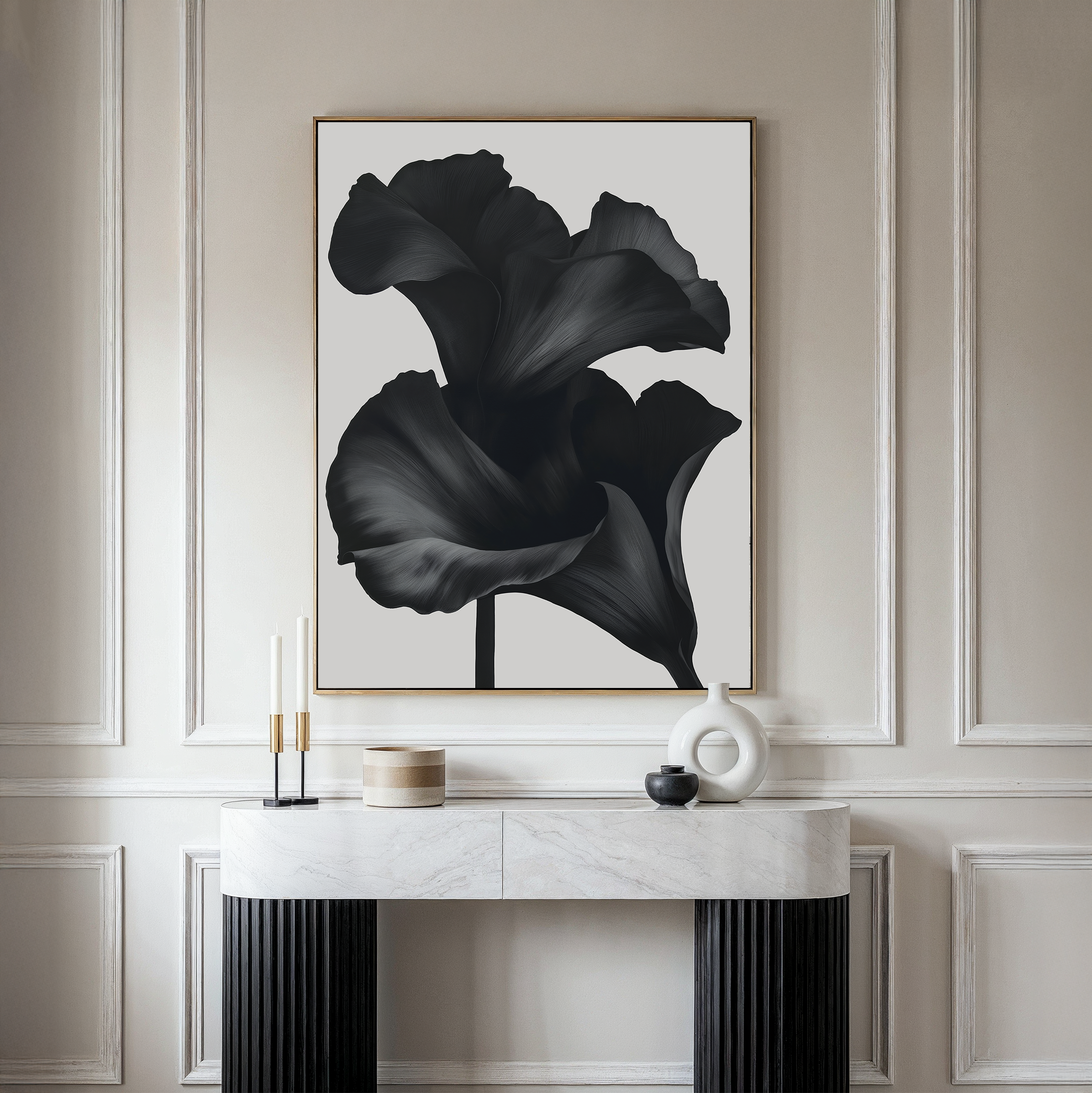 A modern interior showcases a marble console with decorative accents beneath the Noir Bloom Abstract Canvas Art featuring black abstract flowers, all set against an elegant beige paneled wall—perfect for elevated living room decor.