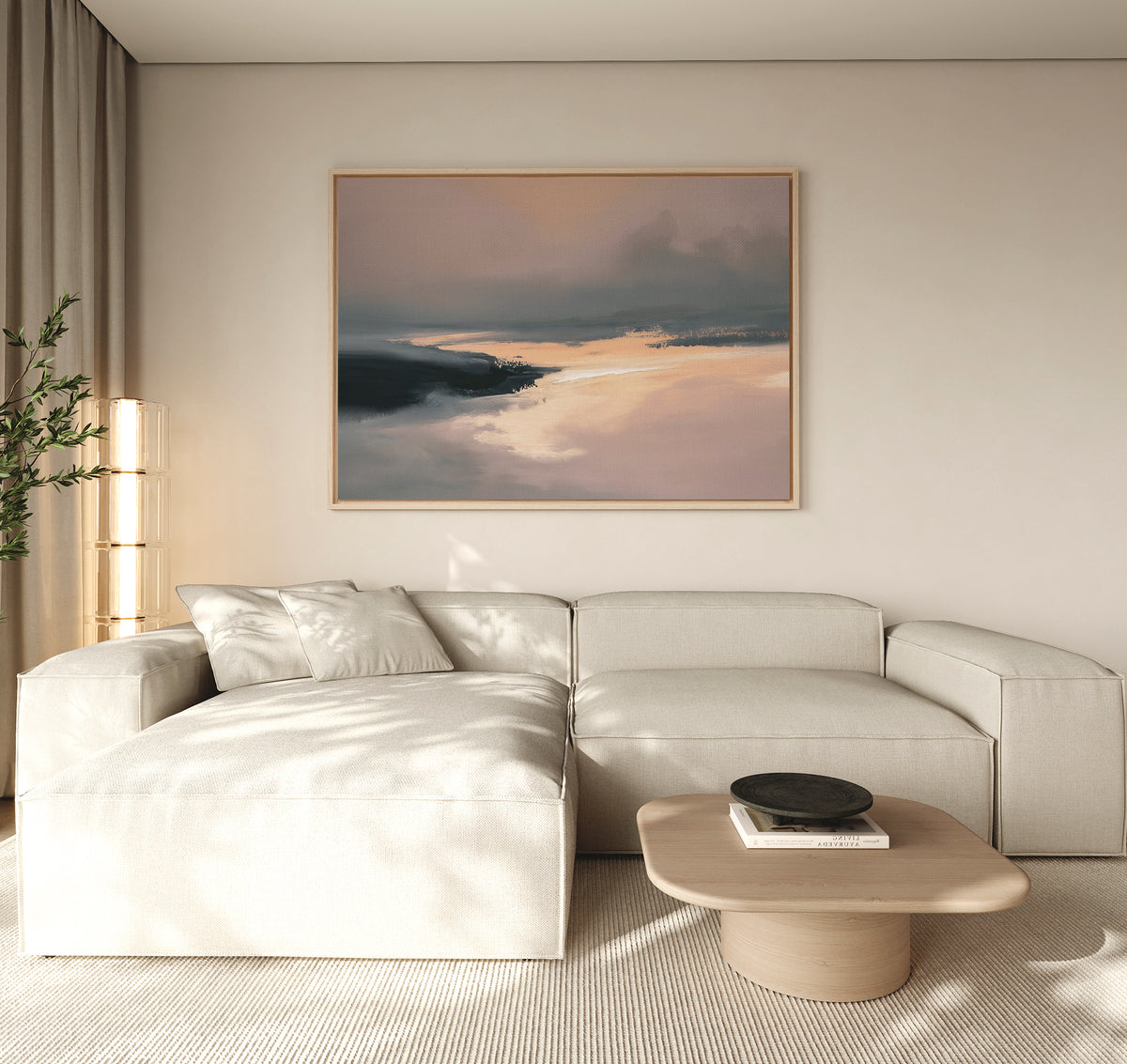 Minimalist living room featuring a light beige sectional, low wooden coffee table with black bowl, tall plant, and the Nordic Fjord Canvas Art - Horizontal—a large abstract landscape in soft tones—hanging above the sofa.