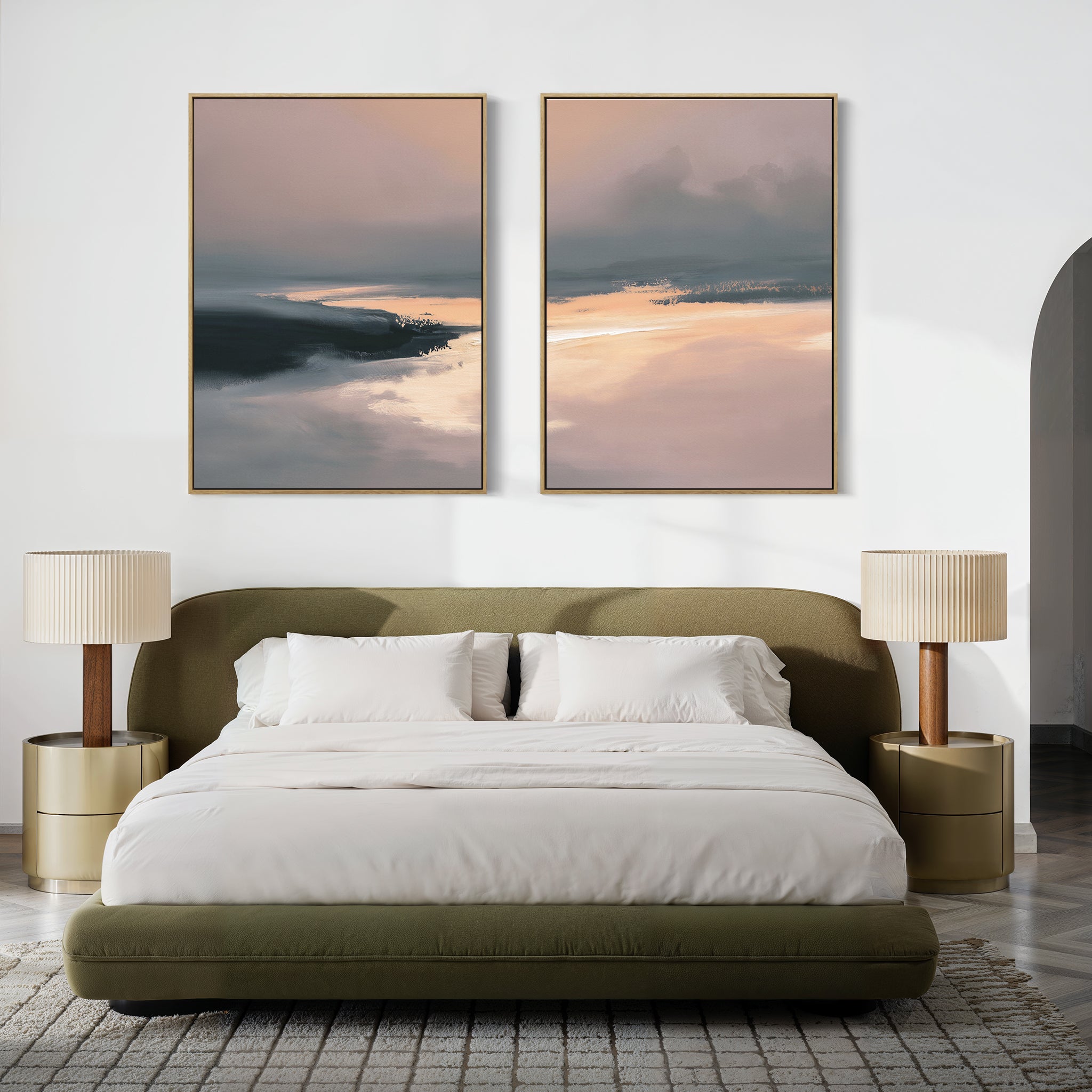 A modern bedroom with a green upholstered bed, white bedding, gold side tables, matching lamps, and the "Nordic Fjord - Set Of 2" peaceful wall art prints above the headboard on a crisp white wall.