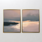 The Nordic Fjord - Set Of 2 features framed abstract prints in beige, peach, and dark grey with misty horizons—peaceful wall art ideal for living room decor, beautifully displayed side by side on a white wall.