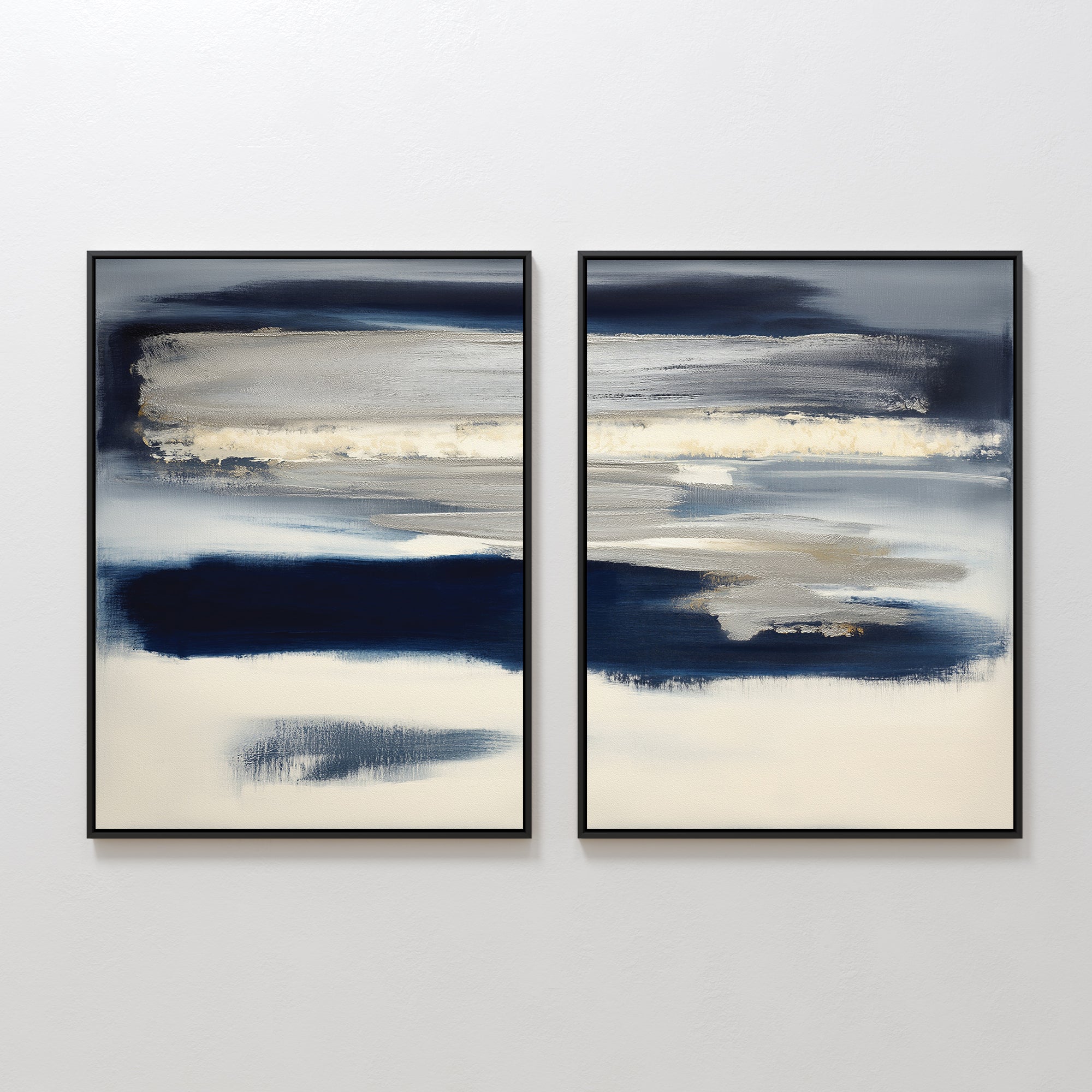 The Northern Tides - Set Of 2 features abstract prints with horizontal brushstrokes in blue, gray, cream, and white tones, creating a serene minimalist look on any white wall.
