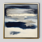 Northern Tides Canvas Art - Square features bold indigo blue, white, and cream brushstrokes for a layered, cloudy look. This contemporary abstract print comes framed in a thin gold metallic frame with a light gray background.