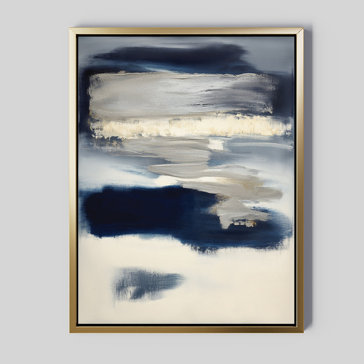 Northern Tides Canvas Art - Vertical features abstract, cloud-like forms with broad brushstrokes in navy blue, white, and gray. Set in a thin gold frame, this minimalist artwork offers a soft, blended look for modern spaces.
