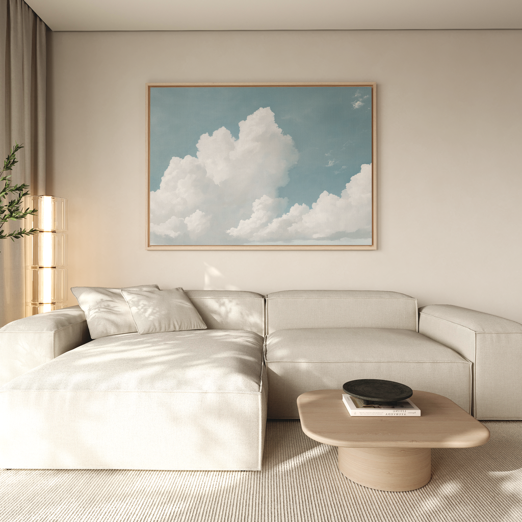 A modern living room features a light beige sectional sofa, a low wooden coffee table with books and a bowl, and the Soaring Peace Canvas Art above the sofa, adding a touch of vintage decor to the space.