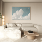 A modern living room features a light beige sectional sofa, a low wooden coffee table with books and a bowl, and the Soaring Peace Canvas Art above the sofa, adding a touch of vintage decor to the space.