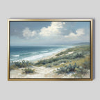 Ocean Bluff Canvas Art - Horizontal: A framed canvas print depicting sandy dunes, green shrubs, and rolling waves beneath a partly cloudy blue sky.
