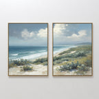 The Ocean Bluff - Set of 2 features framed canvas prints showing sandy dunes, lush green shrubs, and ocean waves beneath a partly cloudy sky, capturing the serene beauty of a coastal landscape.