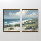 The Ocean Bluff - Set of 2 features framed paintings of a coastal scene with dunes, shrubs, blue ocean waves, and a cloudy sky. The left print emphasizes the water, while the right focuses on the shoreline and horizon.