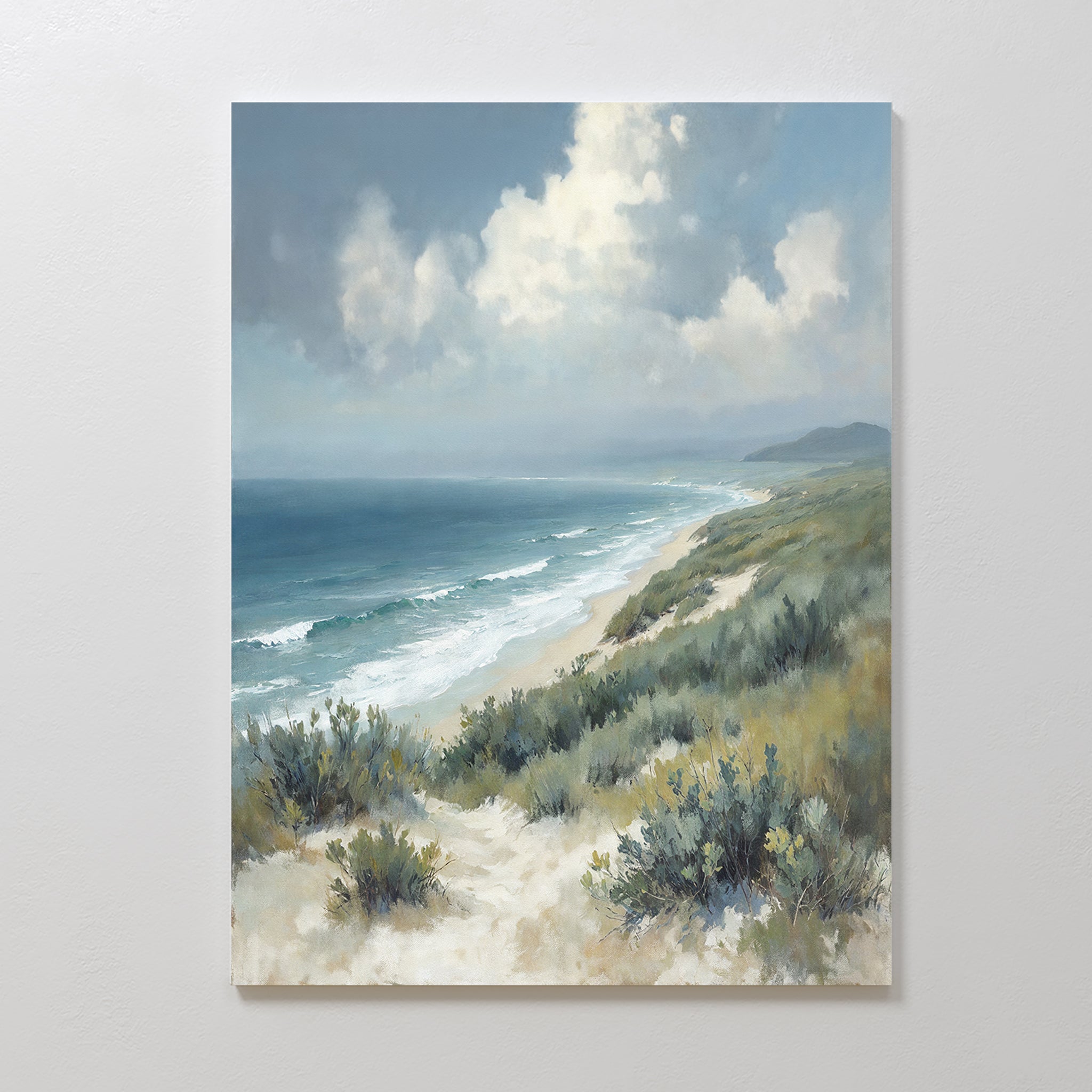 Ocean Bluff Canvas Art - Vertical showcases a peaceful coastal landscape with sandy dunes, green shrubs, and waves beneath a cloudy blue sky—a perfect seaside canvas print for any room.