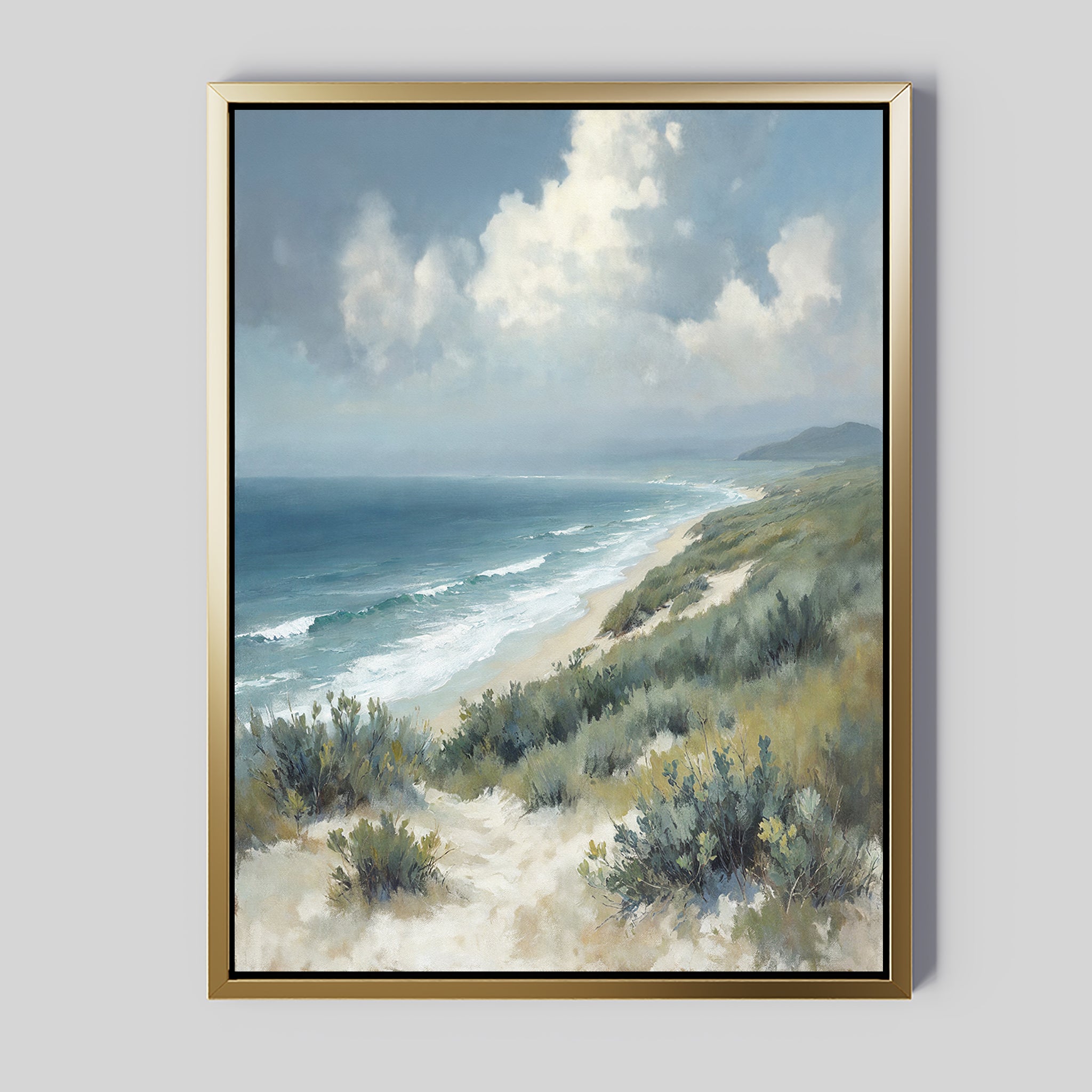 Bring tranquility to your space with the Ocean Bluff Canvas Art - Vertical, showcasing a serene sandy beach with dunes and green shrubs, gentle waves on the shore, and a cloud-filled blue sky over the distant horizon.