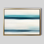 Ocean Motion Canvas Art - Horizontal features abstract blue, teal, and white streaks for a serene coastal vibe. Displayed in a slim gold frame against a light gray wall, it adds minimalist sophistication to any space.