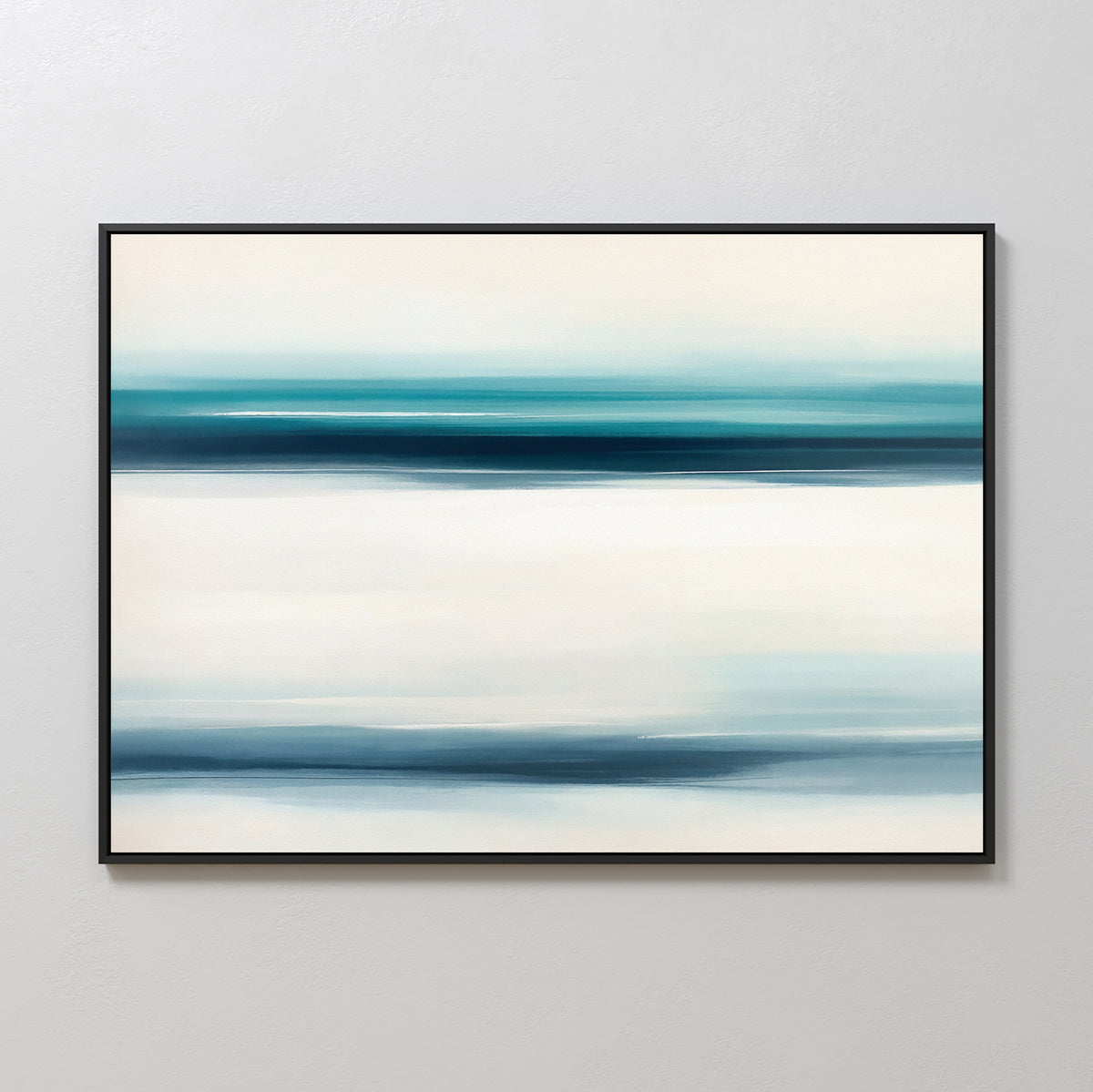The Ocean Motion Canvas Art - Horizontal features blue and teal brushstrokes on a light background, framed in black. Displayed on a light wall, it brings serene sophistication and a calming, minimalist coastal vibe to any space.