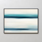 The Ocean Motion Canvas Art - Horizontal features blue and teal brushstrokes on a light background, framed in black. Displayed on a light wall, it brings serene sophistication and a calming, minimalist coastal vibe to any space.