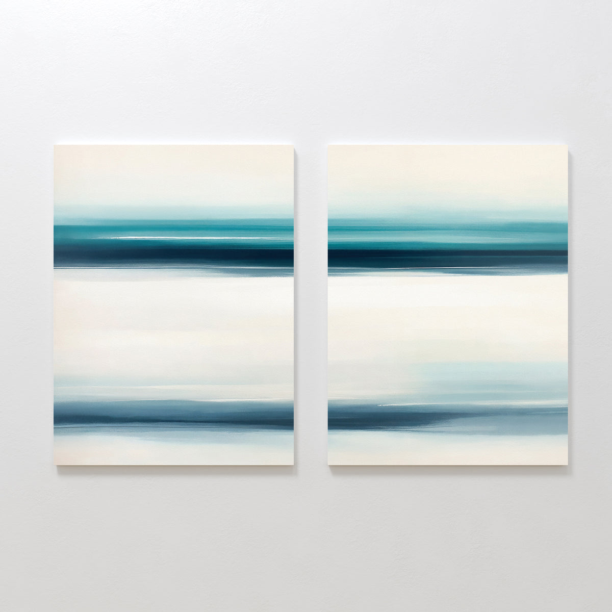 The Ocean Motion - Set Of 2 features abstract prints with horizontal bands of blue, teal, and white, evoking serene seascapes and bringing coastal style and tranquil sophistication to any light wall.