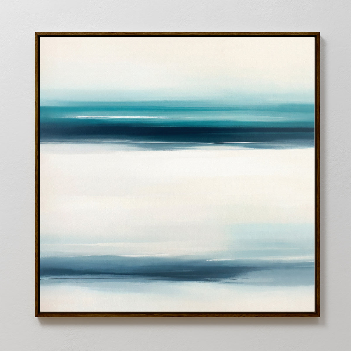 Ocean Motion Canvas Art - Square features an abstract print in a dark frame with softly blended horizontal bands of blue, teal, and white, evoking serene sophistication and a minimalist seascape against a light background.