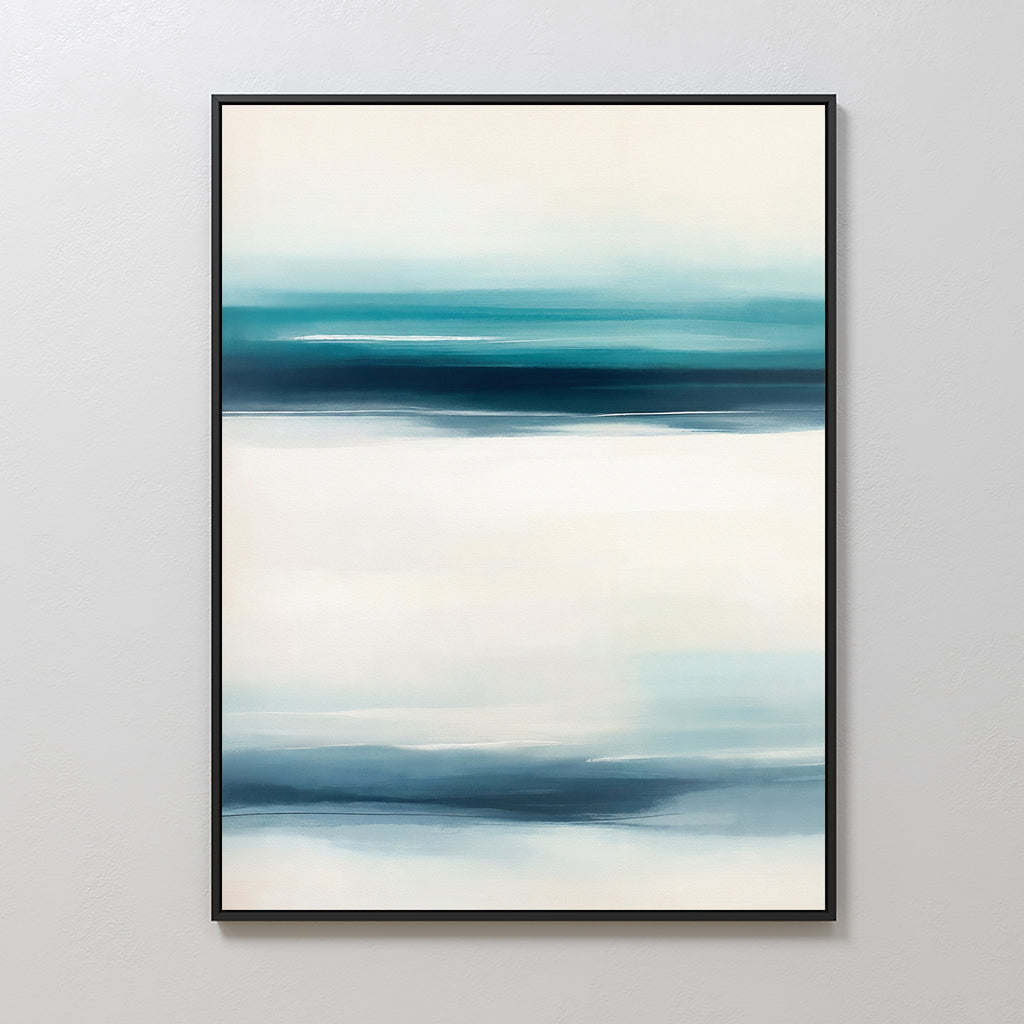 The Ocean Motion Canvas Art - Vertical features softly blended blue, teal, and white streaks. Framed in black and displayed on a light wall, it adds serene sophistication ideal for coastal decor.