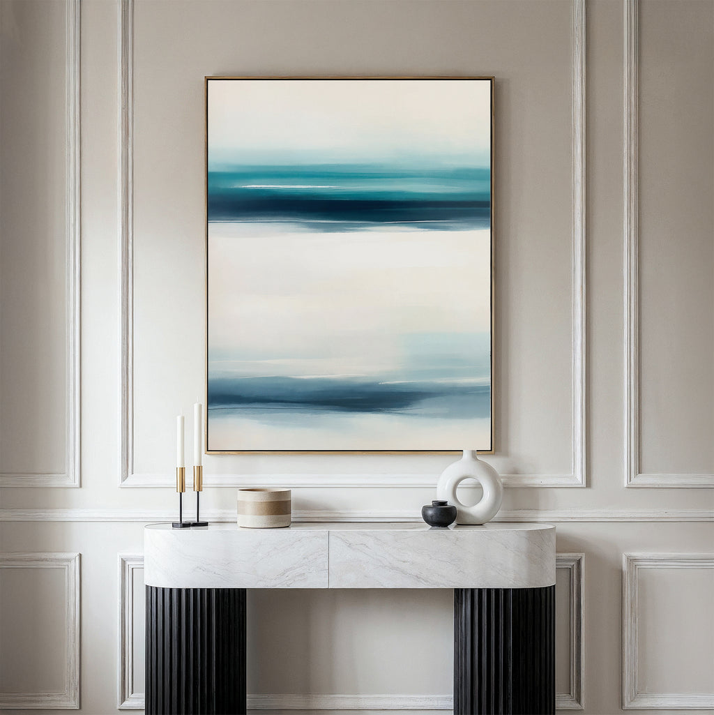 The Ocean Motion Canvas Art - Vertical features blue and white abstract strokes, bringing serene sophistication to a beige wall above a white console table—ideal for coastal decor.