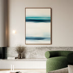 A modern living room with a green curved sofa, marble and wood console, coastal decor, dried branch vase, and the Ocean Motion Canvas Art - Vertical above soft lighting for serene sophistication.