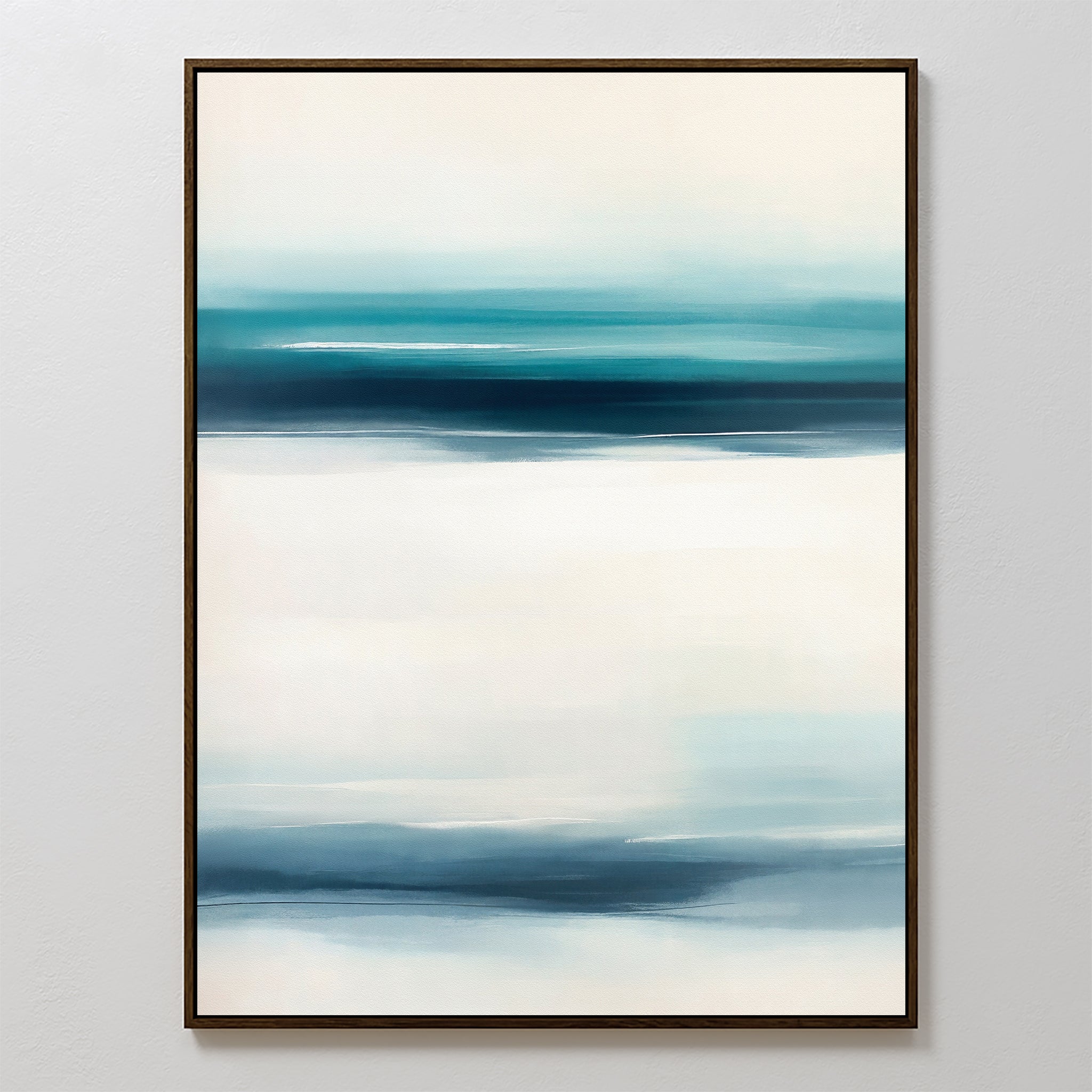 Ocean Motion Canvas Art - Vertical showcases an abstract print with vertical bands of blue, teal, and white blending smoothly. Framed and displayed on a light wall, this artwork brings serene sophistication with its soft color transitions.