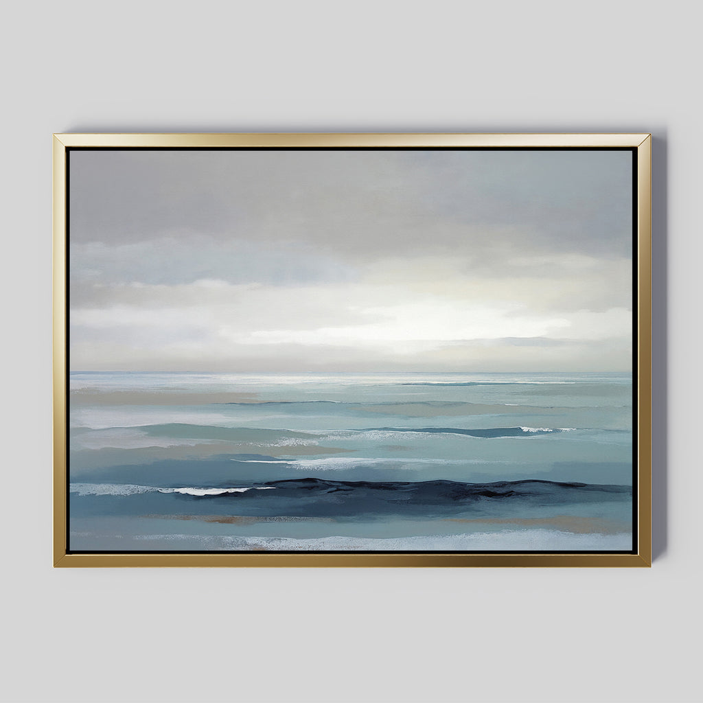 The Ocean Swells Canvas Art - Horizontal features a tranquil seascape in muted blue and gray tones, with soft waves and a cloudy sky, creating serene wall art that adds a peaceful ambiance to any room.