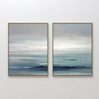 Ocean Swells - Set Of 2: Two framed prints featuring serene seascapes in soft blue, gray, and white tones—perfect coastal wall art for a peaceful, minimalist space.