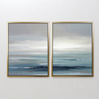 Ocean Swells - Set Of 2 features two framed paintings showcasing gentle waves and a cloudy sky in soft blue and gray tones, bringing a peaceful, minimalist Nordic Park feel—ideal as serene wall art for any space.