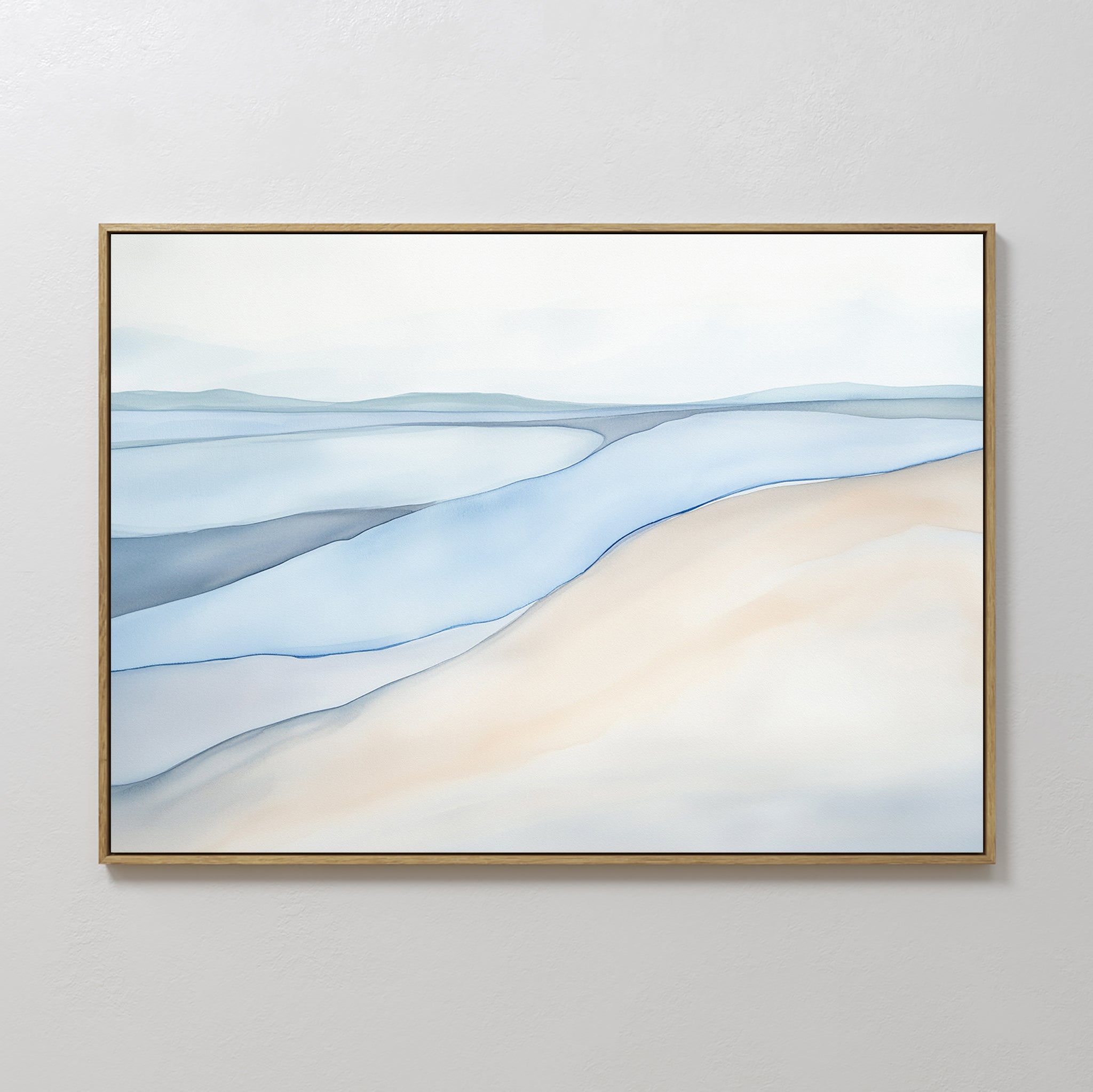 The Pale Currents Canvas Art - Horizontal features a minimalist abstract landscape with soft shapes in light blue, beige, and white, evoking water and sand under a pale sky. Elegantly framed with a thin gold frame for a calming touch to any space.