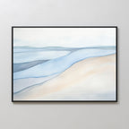 The Pale Currents Canvas Art - Horizontal features a minimalist watercolor landscape in soft blue, beige, and gray tones. Framed in black and shown on a light-colored wall, this abstract artwork evokes calming hills and serene waters.
