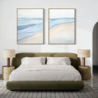 A modern bedroom features a green upholstered bed, white bedding, two beige round nightstands with matching lamps, and "Pale Currents - Set of 2" abstract prints above the bed. A gray area rug on the wooden floor completes the serene Nordic Park vibe.