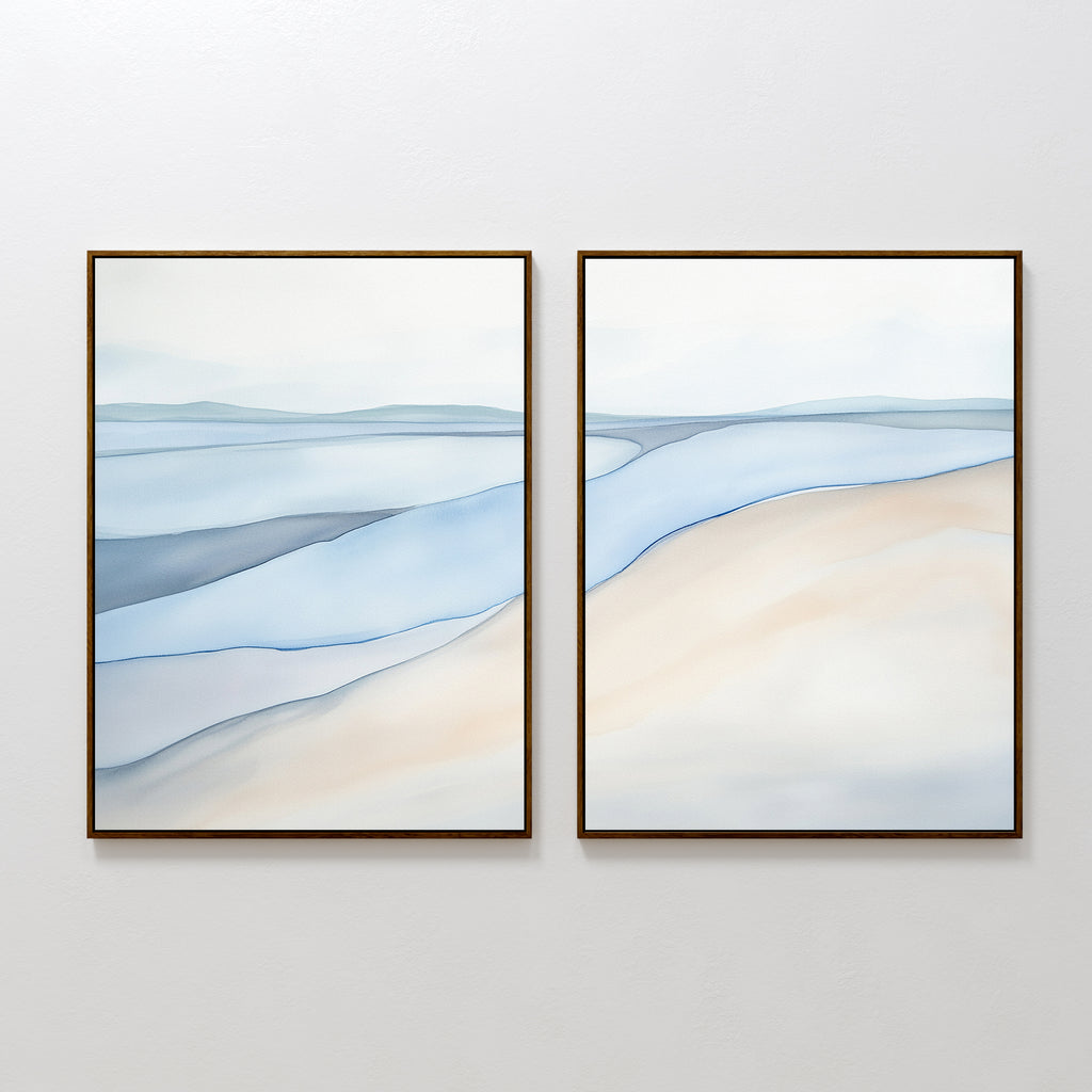 Pale Currents - Set of 2: Minimalist diptych with abstract canvas prints showcasing gentle waves and sandy shorelines in soft blue, beige, and white. Creates a calming, serene look perfect for Nordic Park-inspired spaces.