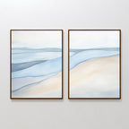 Pale Currents - Set of 2: Minimalist diptych with abstract canvas prints showcasing gentle waves and sandy shorelines in soft blue, beige, and white. Creates a calming, serene look perfect for Nordic Park-inspired spaces.