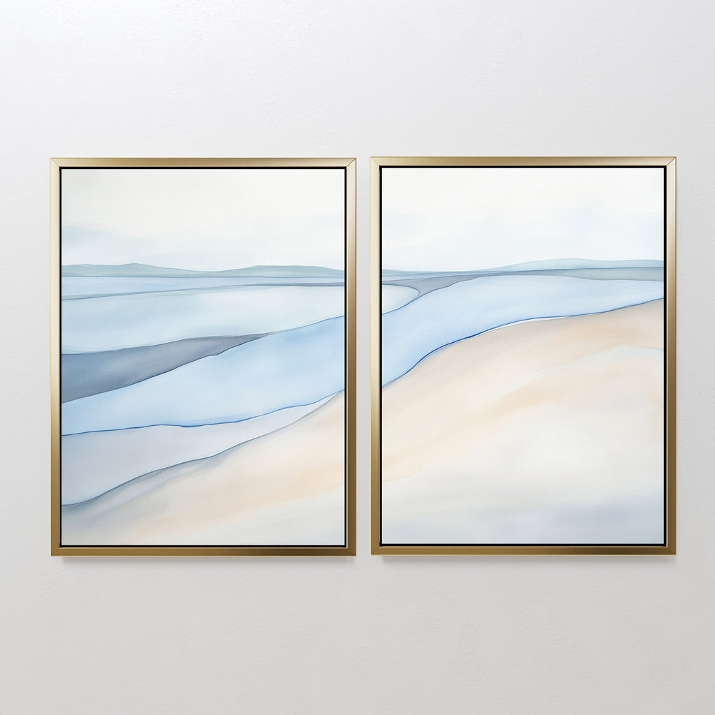 Pale Currents - Set of 2 features calming abstract canvas prints in soft blue, beige, and white tones with thin gold frames—perfect for adding serene shoreline vibes and Nordic Park elegance to your space.