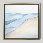 The Pale Currents Canvas Art - Square features soft, flowing lines in pastel blue, beige, and white to evoke gentle hills or waves. This serene abstract print comes framed in a simple gold-colored frame against a light background.