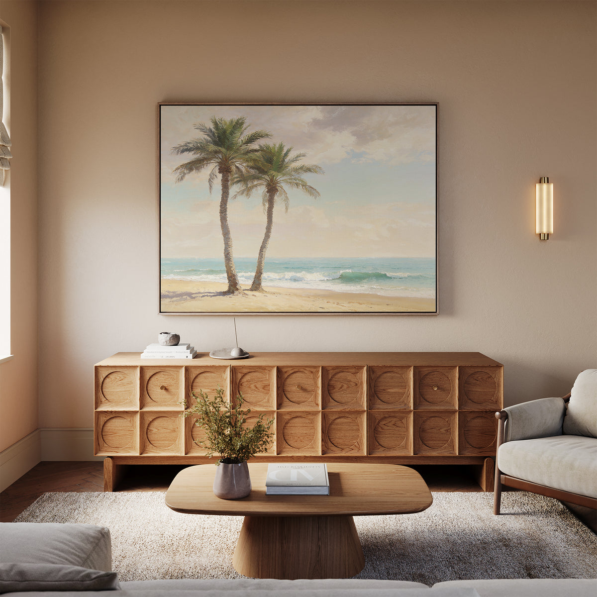 A cozy living room features a wooden coffee table, light sofa, textured sideboard, and the Paradise Found Canvas Art - Horizontal above it. Warm neutrals and coastal artwork create an inviting, relaxed atmosphere.