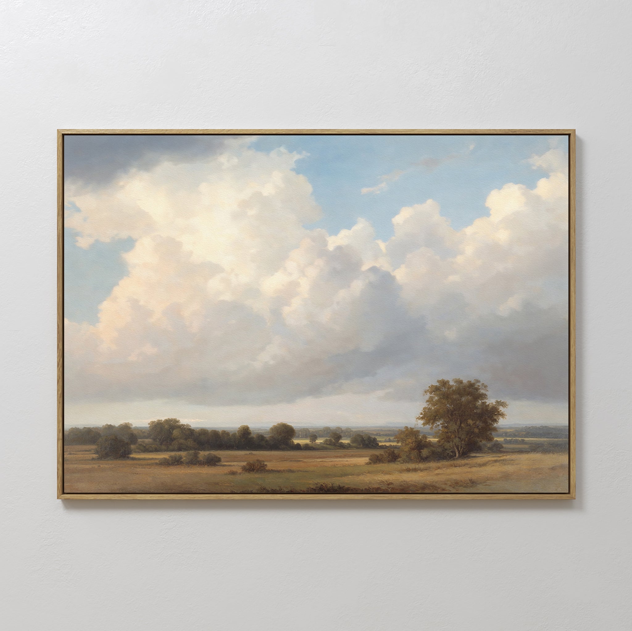 The Pastoral Grandeur Canvas Art - Horizontal features a serene field with scattered trees and billowing clouds, using soft, natural colors and a distant horizon to bring calming countryside beauty to your space.