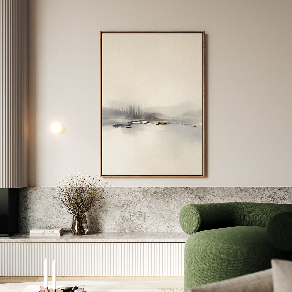 A modern living room features the Peaceful Lake Morning Canvas Art - Vertical, a green curved sofa, a marble accent wall, and dried flowers on a low shelf, creating a tranquil atmosphere.